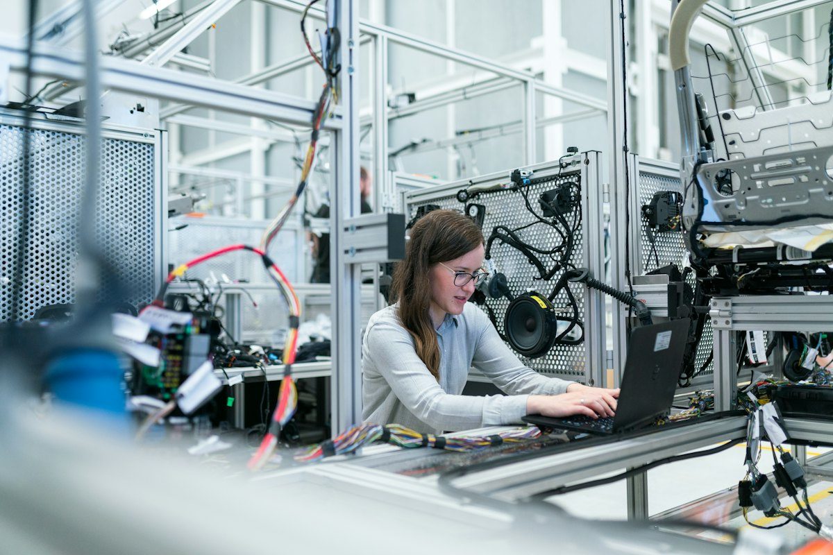 Engineer working with machinery in a modern workshop